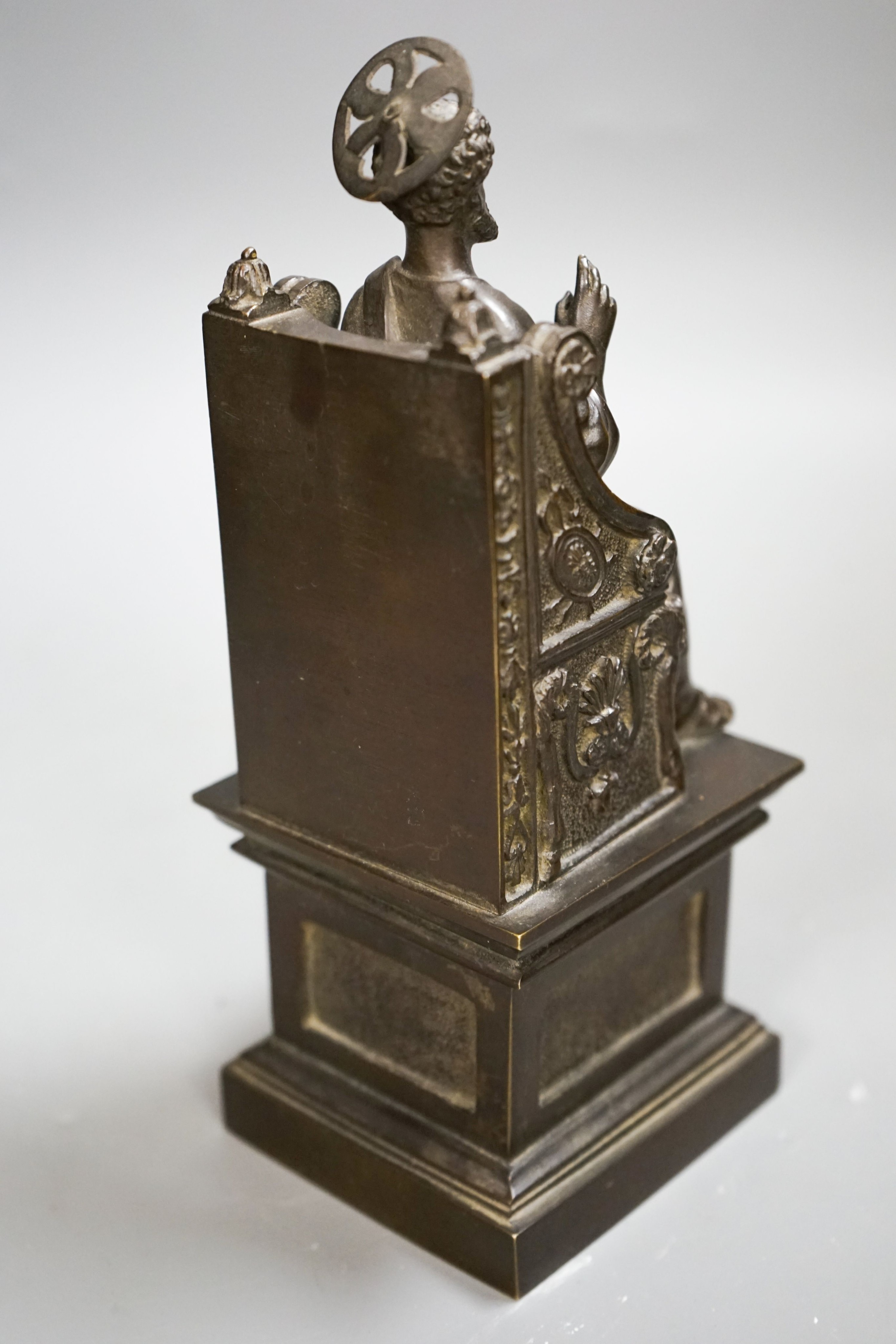 A late 19th century bronze figure of St. Peter seated on a throne, 22cm